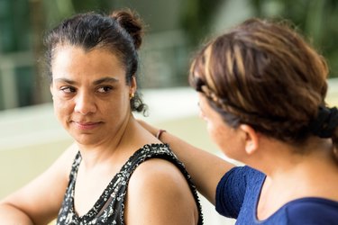 woman comforting friend coping with breast cancer