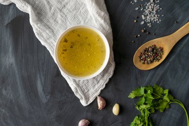 home cooked boullion or clear soup in a ceramic bowl at the kitchen, healthy food and diets