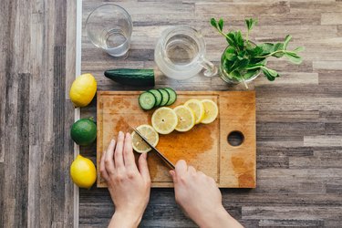 woman cutting lemon