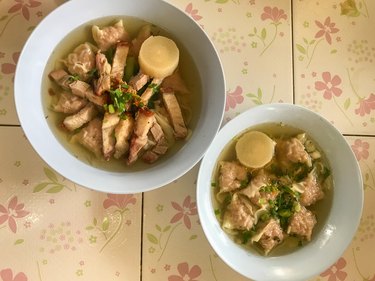 hot soup crispy pork and wontons on bowl, Thai Food