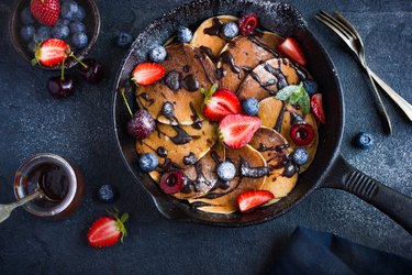 pancakes with fresh berries and chocolate sauce for cast iron breakfast