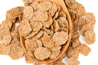 pile of bran flakes isolated on white