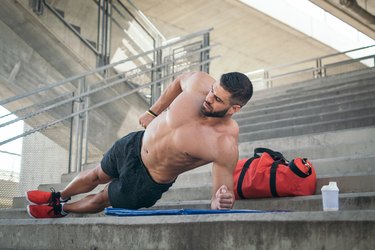 Man doing side plank for six-pack abs without crunches