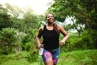 woman exercising in nature for blood glucose homeostasis during exercise