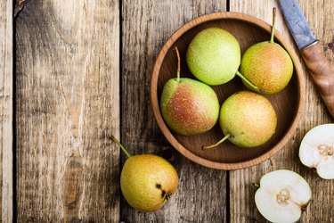 Ripe pears on rustic table