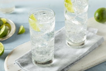 Two glasses of sparkling water with lime slices