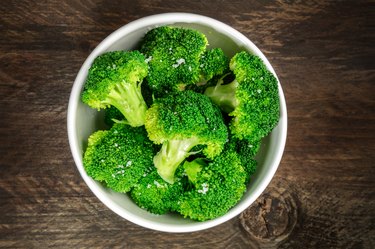 Cooked green broccoli with sea salt and copyspace