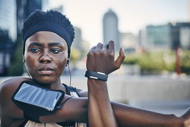 Young female runner about to do a summer workout