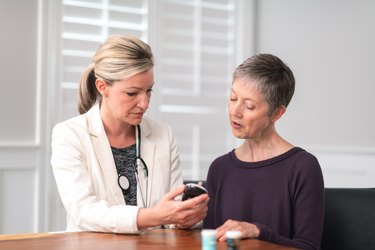 Female doctor consults with female patient about normal blood sugar range for women