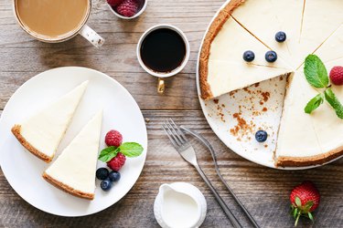 Homemade no-bake cheesecake and coffee on wooden table