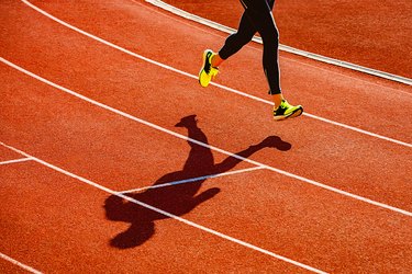 Sportsperson running over the running track