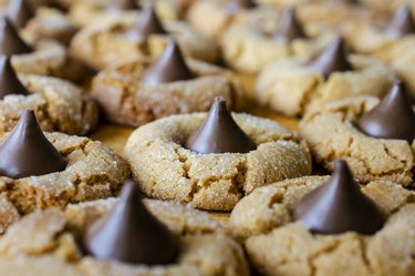 Peanut butter blossom cookies with hershey's kisses on cutting board