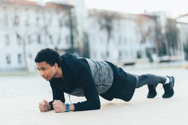 Sporty man doing plank