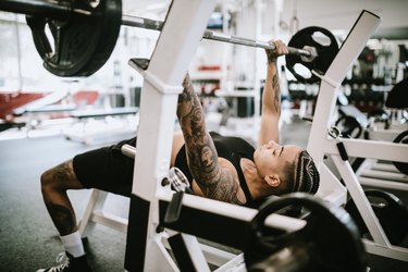 Strong and Fit Woman Working Out in Gym