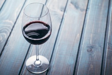 Red wine on blue wood