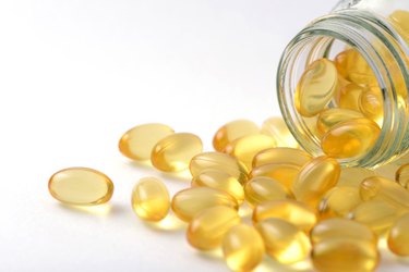 Fish oil and Evening Primrose capsules pills and container