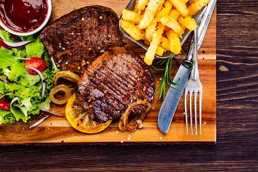 Grilled steak with french fries and vegetable salad