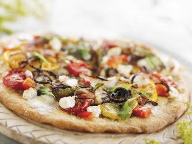 Vegetable Pizza on a Round Cutting Board