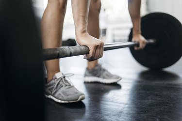 Woman lifting weights with wrist pain