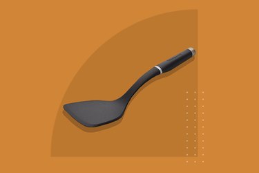 black spatula on orange background