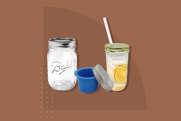 A standard Mason jar positioned near its updated accessories, including a cup separator and a top thats fitted for a traw.