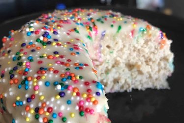 High-Protein Birthday Mug Cake closeup with sprinkles