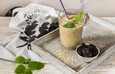 Digestive Smoothie with mint leaf on wooden board