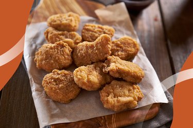 Baked Chicken Nuggets Recipe on a wooden board with parchment paper