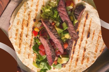 Grass-fed Steak Taco With Cowgirl Salsa on a large grilled tortilla
