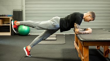 Move 5: Elevated Plank With Alternating Leg Lift