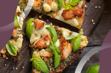 Slices of Spicy Chicken and Basil Pizza on a cutting board