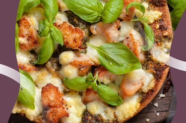 Slices of Spicy Chicken and Basil Pizza on a cutting board