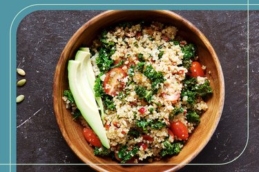 overhead photo of healthy grain bowl with quinoa, tomatoes, parsley and avocado