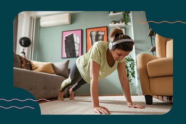 woman in high plank position about to do push-up for 30-day push-up challenge at home