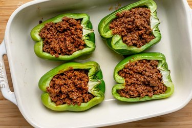 Fill pepper halves with beef.