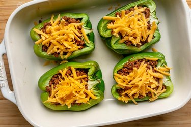 Sprinkle peppers with cheese; bake until melted.