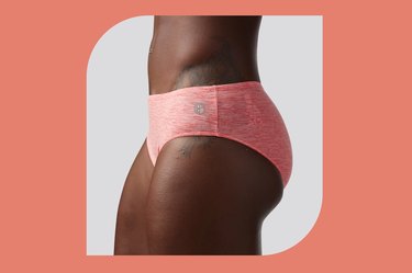 coral born primitive athleisure undies on a white and coral background