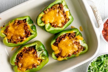 Taco-Stuffed Peppers in white baking dish