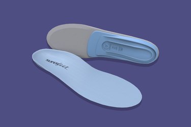 Superfeet Blue shoe inserts on a purple background