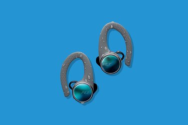 Blue and Grey Plantronics Backbeat Fit 3100 True Wireless Earbuds on a Blue Background