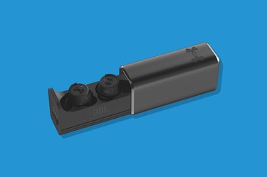 Black Under Armour True Wireless Flash X Earbuds on a Blue Background