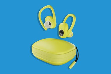 Yellow Skullcandy Push Ultra True Wireless Earbuds for Running  on a Blue Background