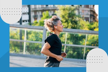 profile view of runner wearing black t-shirt and headphones in a city