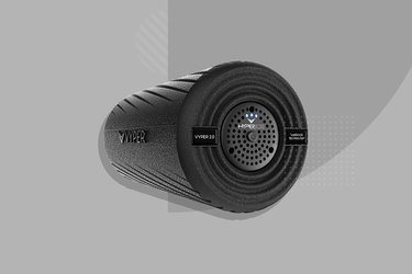 black Hyperice vibrating foam roller on gray background