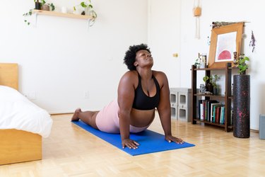 Balancing Stick And One Armed Peacock Yoga Pose High-Res Stock Photo -  Getty Images