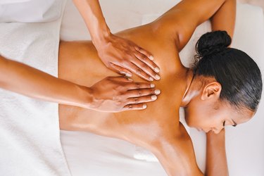 Top view of a mom getting a massage at a spa, to represent the Soothe Mother's Day sale