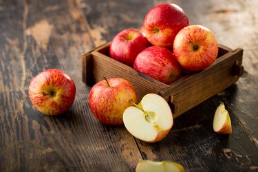 boron-rich apple isolated on wood background