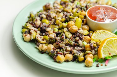 Cooked edamame beans, chickpeas, pearl barley, red quinoa, mung beans and black rice in a refreshing lemon dressing