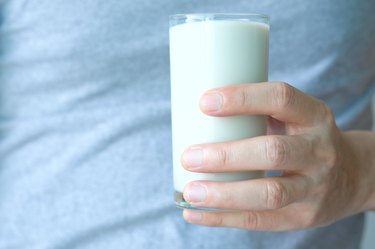 Man with a glass of soy milk.