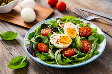 Breakfast salad with boiled egg and vegetables